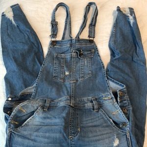Distressed denim overalls